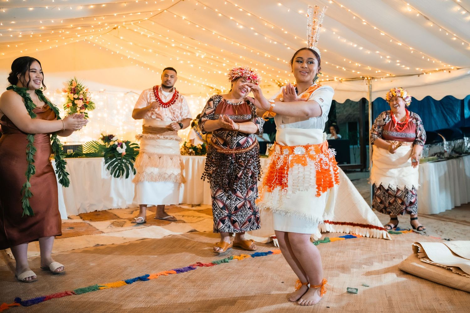 People dancing and enjoying themselves on a crowded dance floor at a party or nightclub celebration.