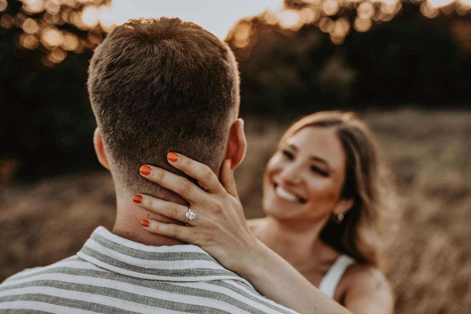 Couple soaking in golden sunshine during their Flower Mound engagement session