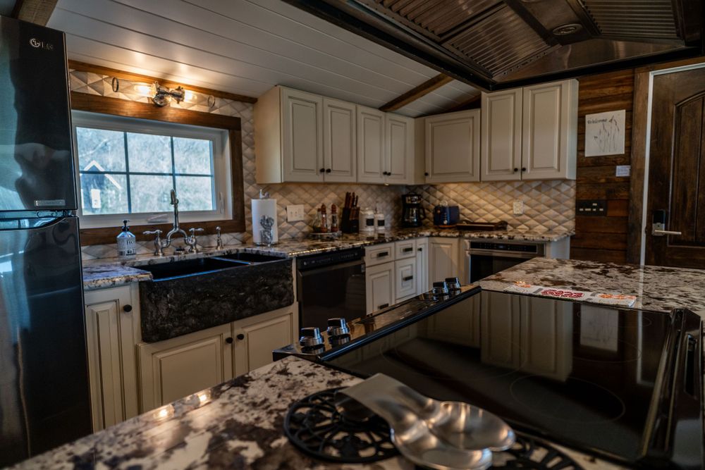 Modern Airbnb kitchen with sleek appliances, spacious counter space, and stylish decor, perfect for cooking and dining.
