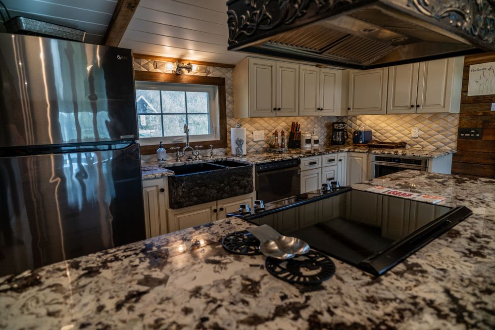 Modern Airbnb kitchen with sleek appliances, spacious counter space, and stylish decor, perfect for cooking and dining.