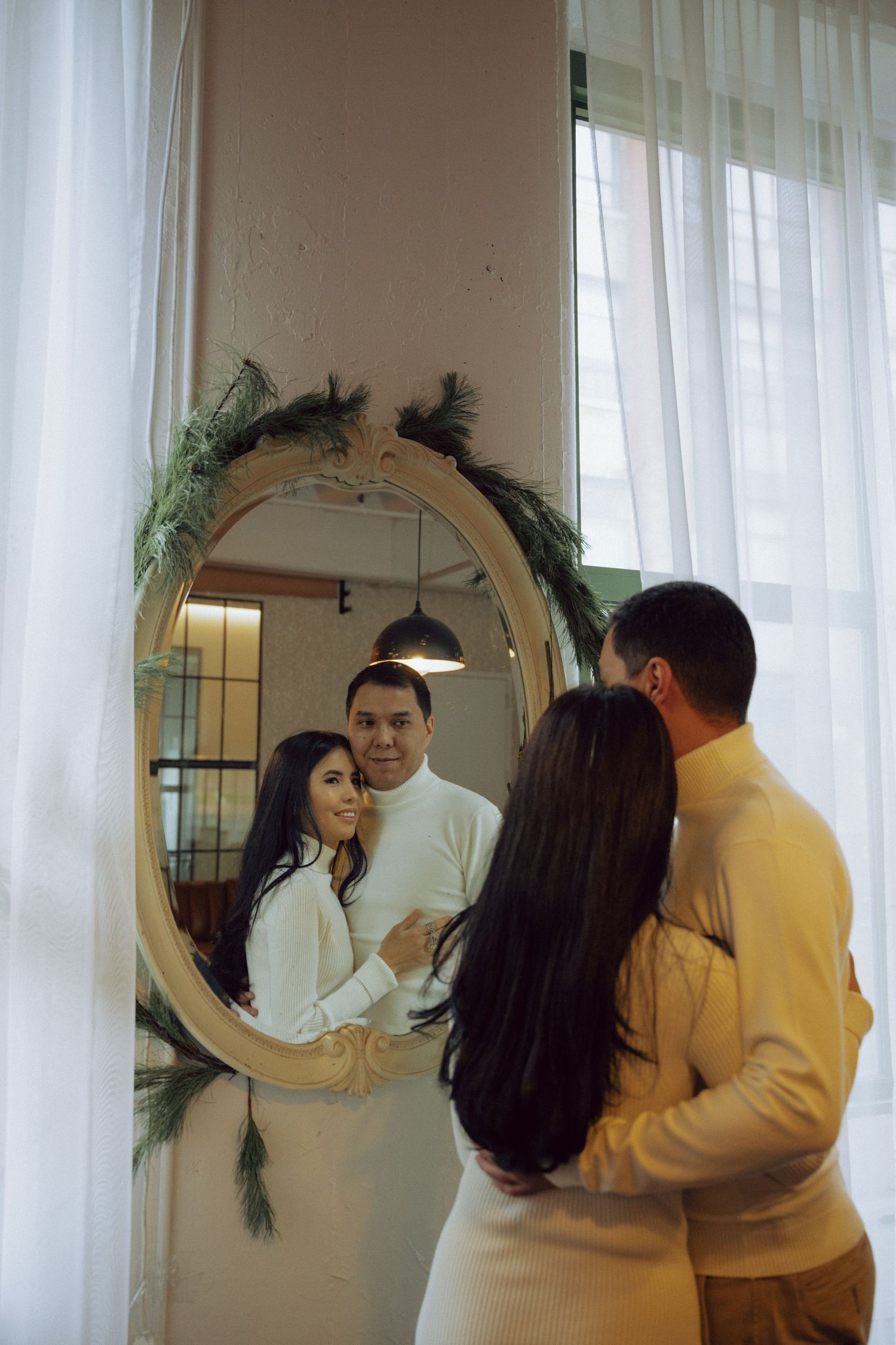 A heartfelt engagement photoshoot capturing raw emotions in a cozy café setting, featuring cinematic moments of love and connection