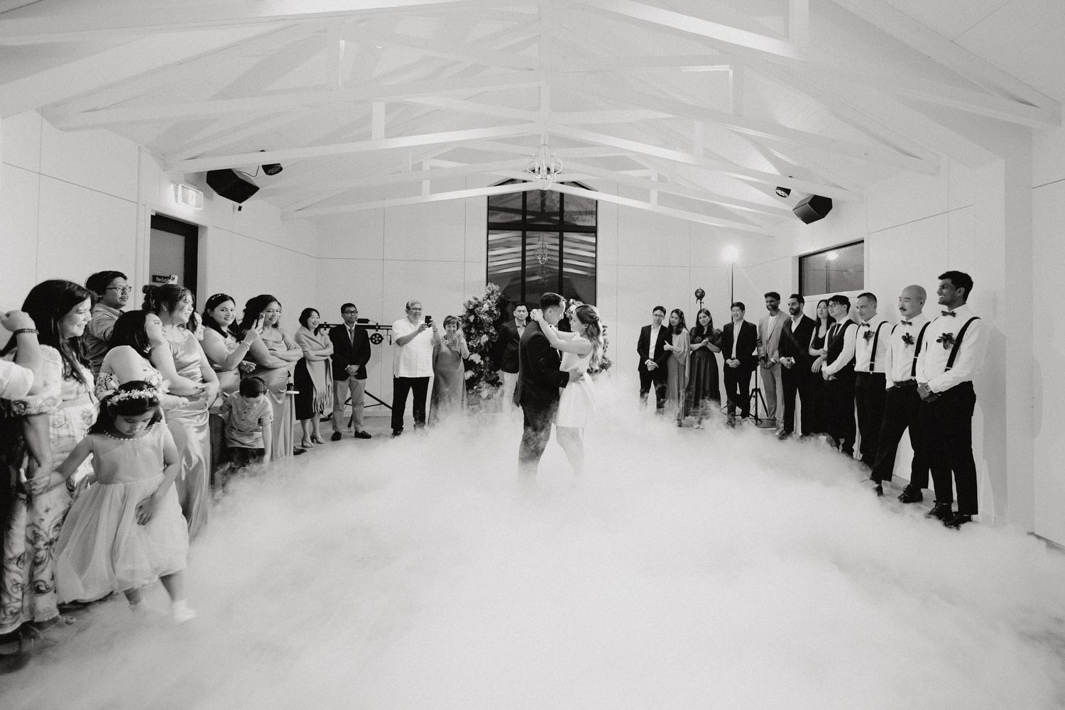 The bride and groom for their first dance captured by Apertured Media Auckland Wedding Photographer.