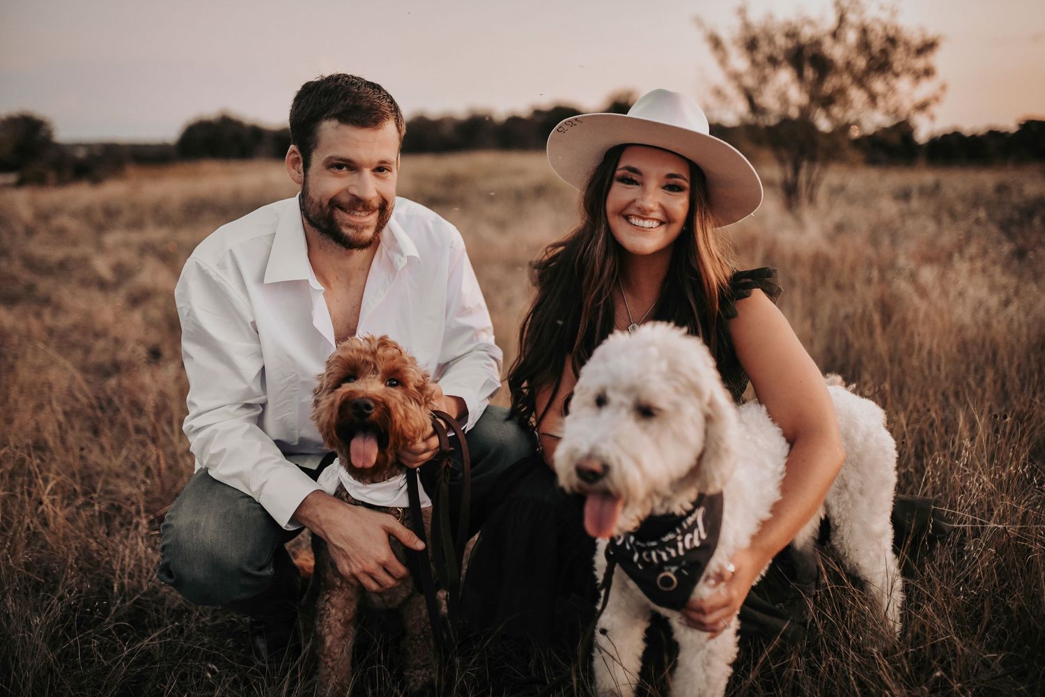 save the date photos of an engaged couple posing with their sweet fur babies taken by april pinto photography