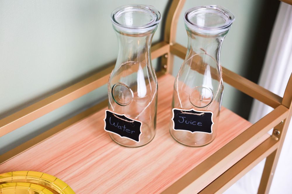 Two empty glass milk bottles custom studio in Carlsbad New Mexico. Newborn Photography. Maternity Photography. Newborn Pictures