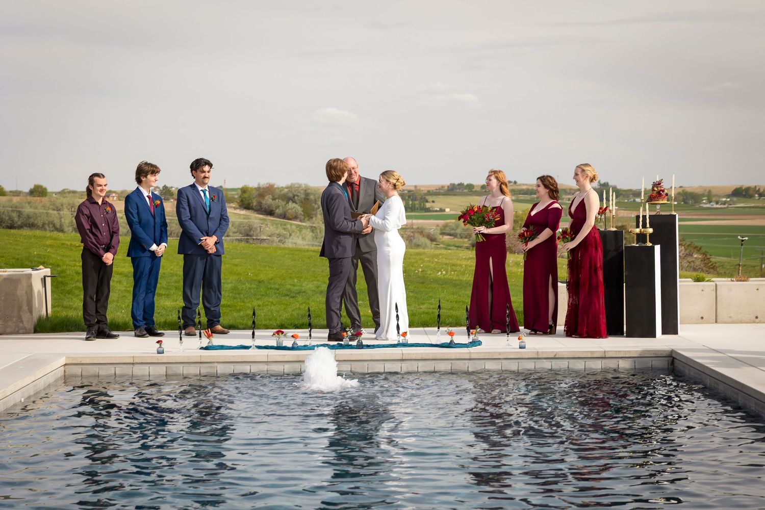 Wedding party by pool at Garman Hill Wilder Idaho