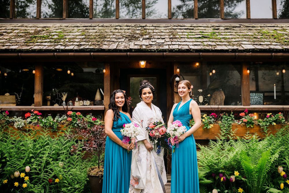 Lodge wedding venue with decorative gardens and ferns in the foreground.
