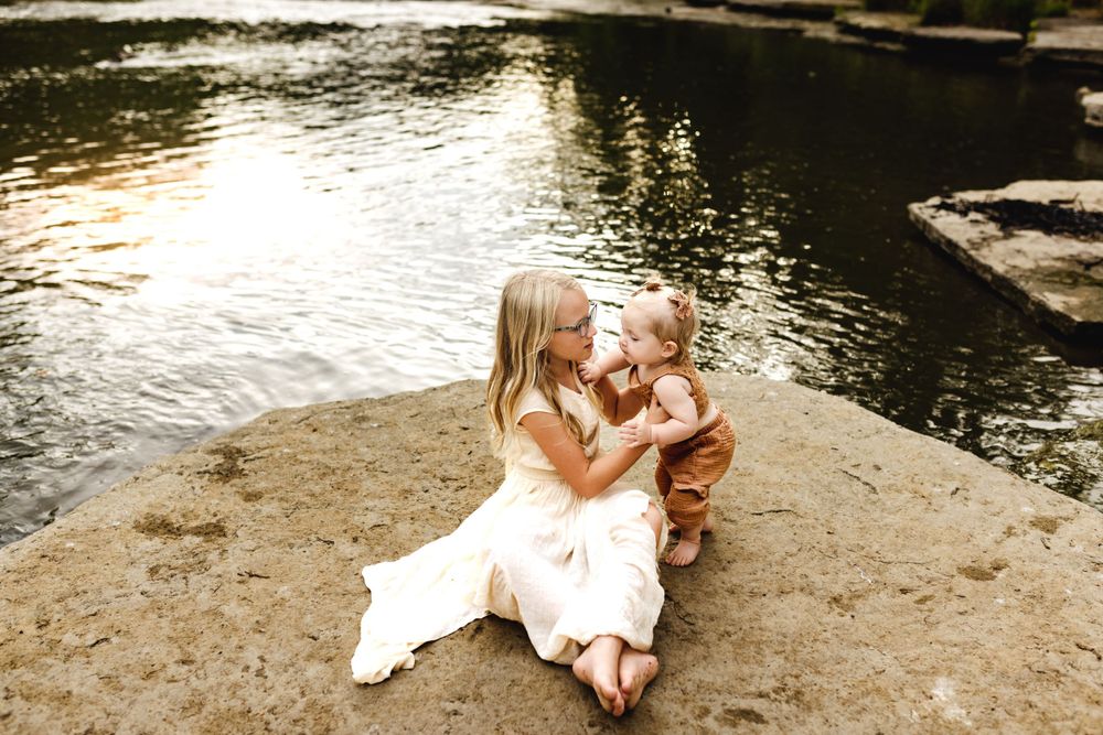 Sibling photo on rocks in Marion Indiana during a family photoshoot