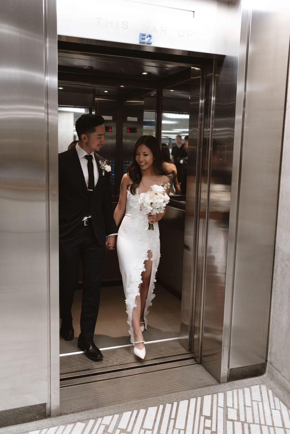 Toronto couple elevator wedding photos at city hall, captured by Jess GC Photography