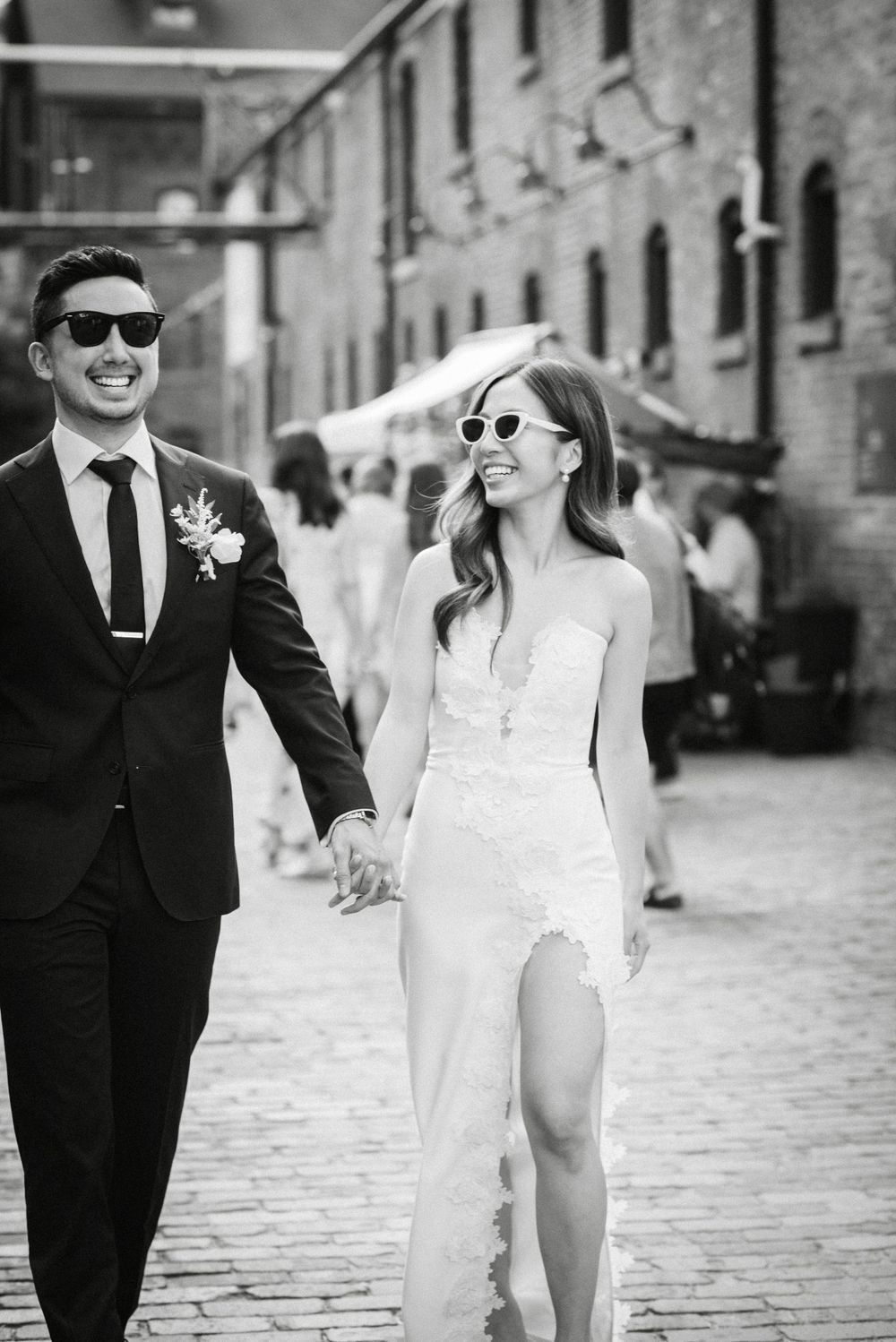Toronto couple wearing sunglasses for wedding photos in the distillery district captured by Jess GC Photography