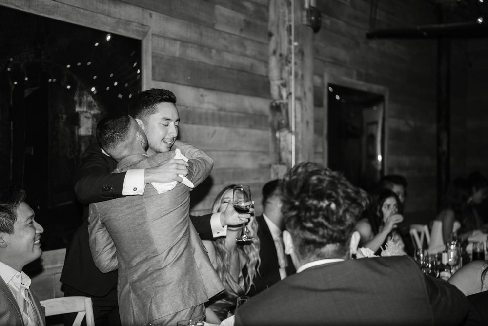 Groom hugging friend at The loft distillery district wedding in Toronto, captured by Toronto Wedding Photographer Jess GC Photography