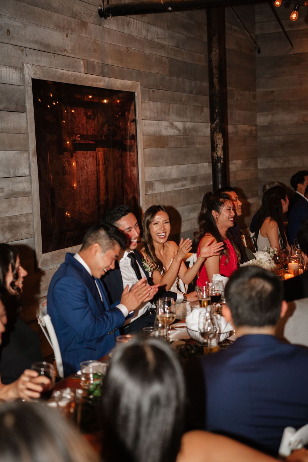 Bride and groom candids laughing at dinner at The loft distillery district, by Toronto Wedding Photographer Jess GC Photography