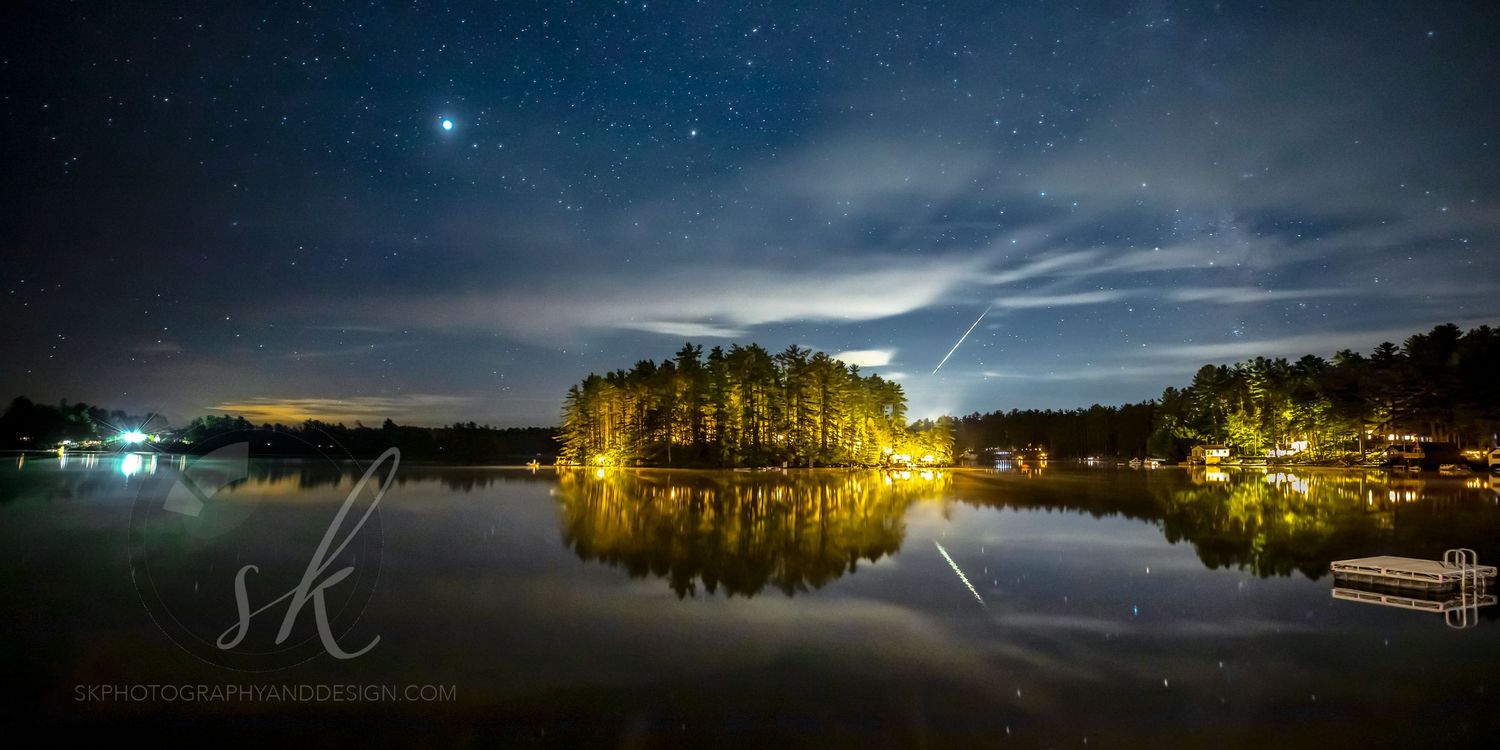 Brantingham Lake night photo with shooting star over Grant Island.