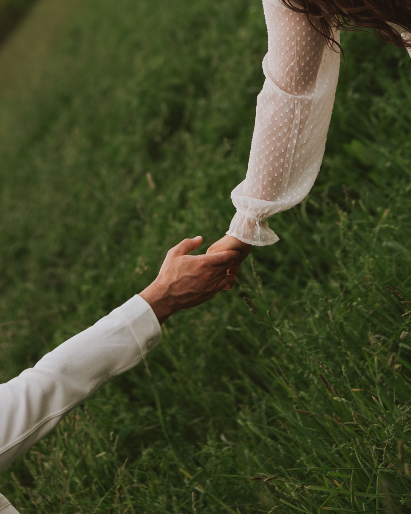 Intimate moment between newlyweds with bride wearing delicate floral crown.