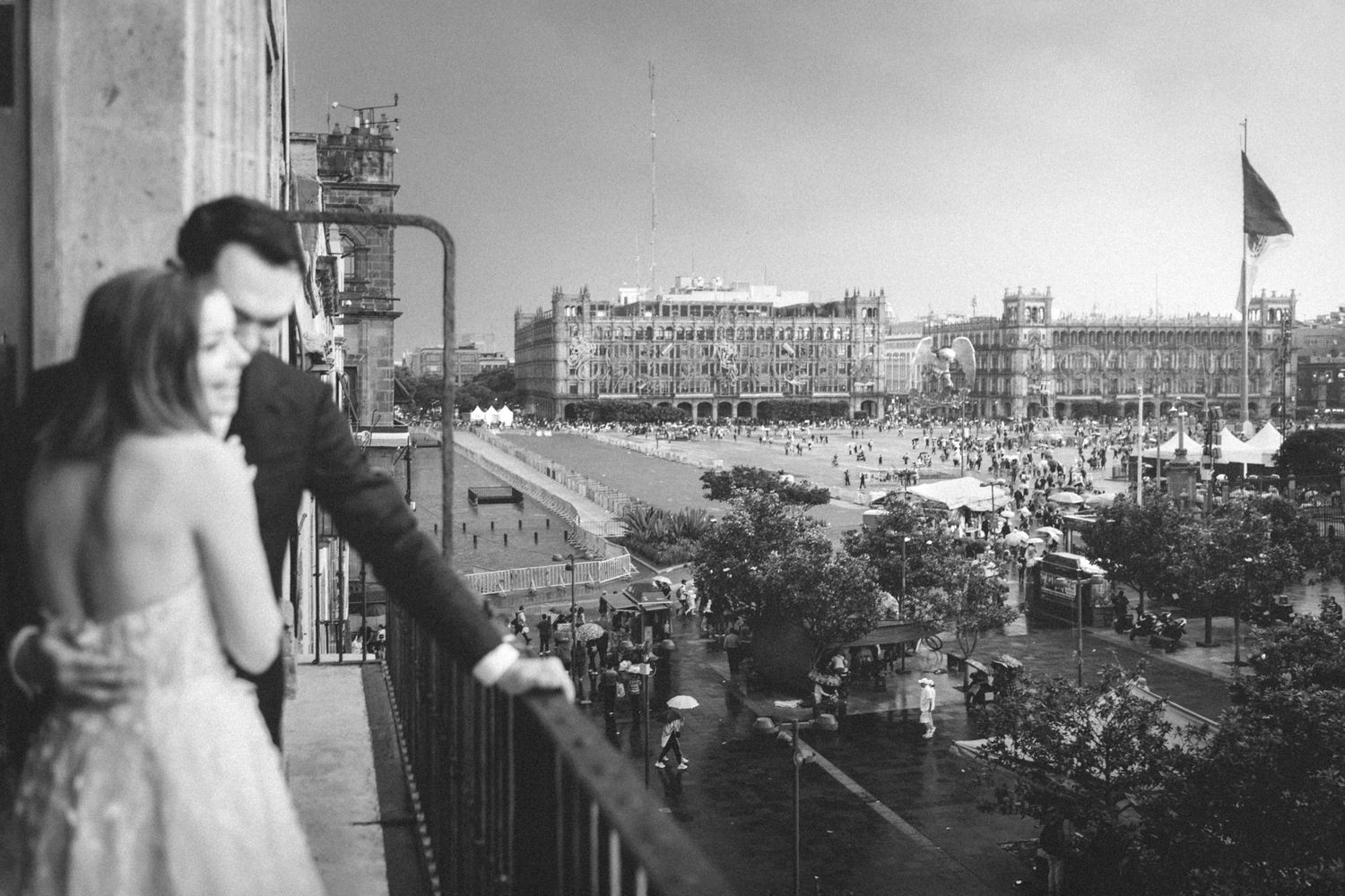 Historical black and white panorama of a city skyline with industrial buildings and construction sites.
