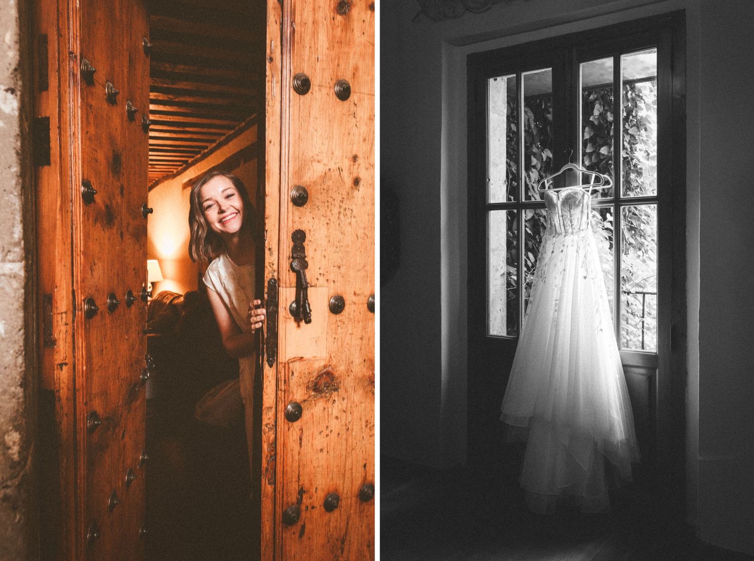 Wedding dress hanging in window light next to rustic wooden door creating moody atmosphere.