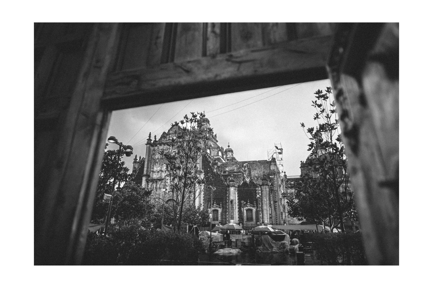 Historic stone church exterior photographed in dramatic black and white architectural style.