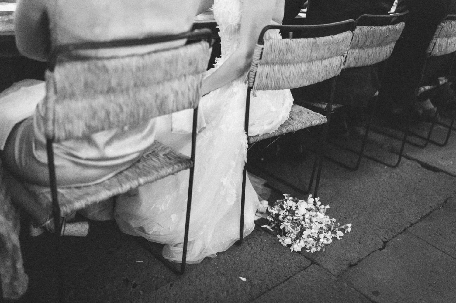 Guests relaxing on vintage couches and lounge furniture at an elegant wedding reception.