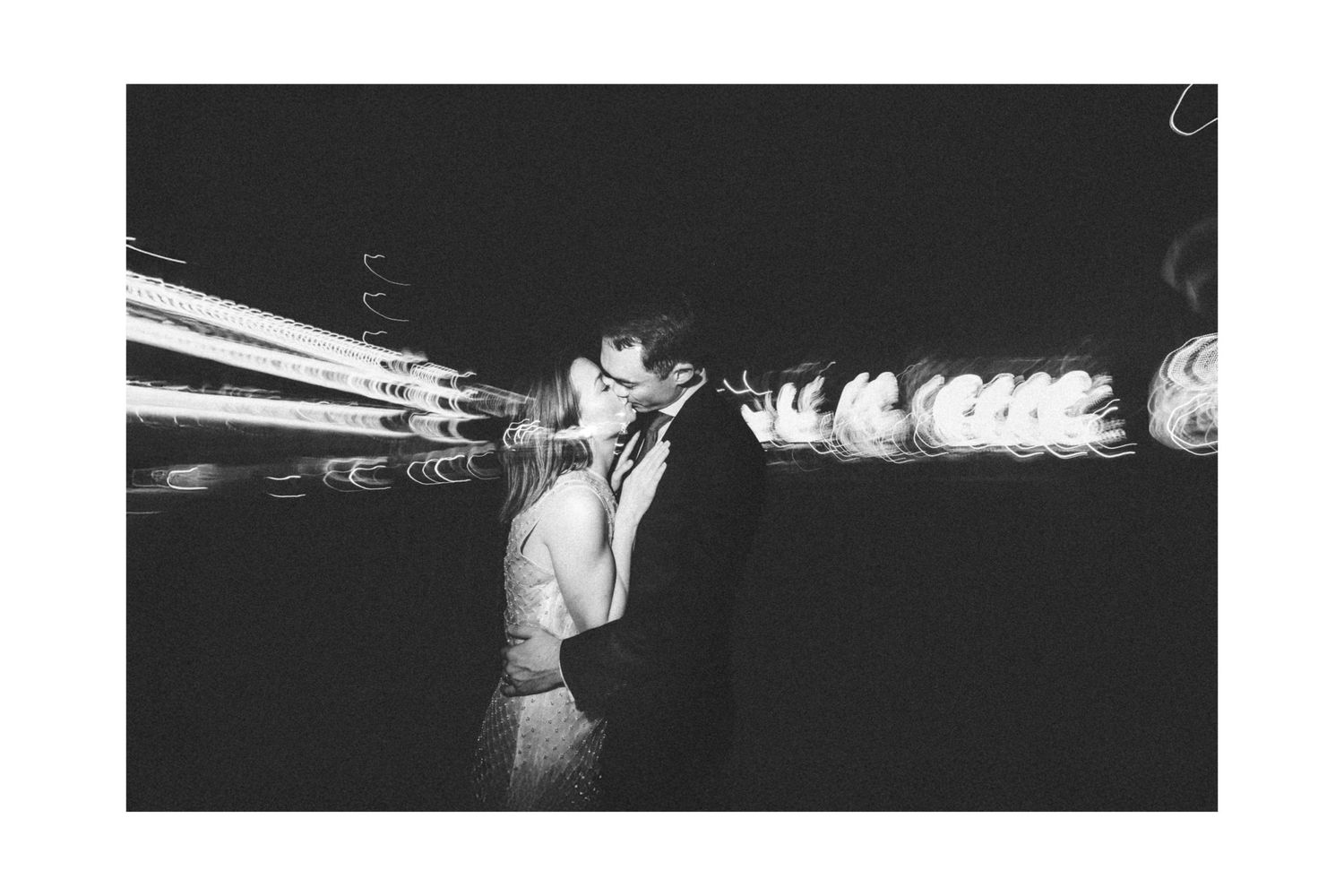 Motion blur photograph capturing movement in a dark indoor space.