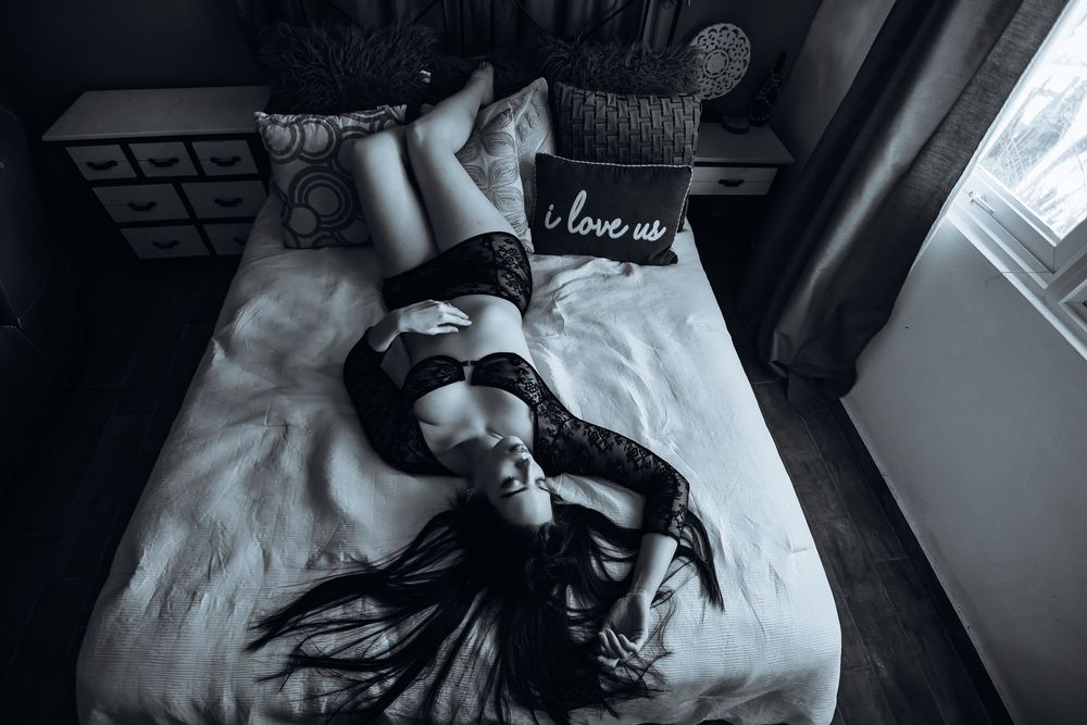 A black and white photography series showing intimate moments in bed captured from different angles.