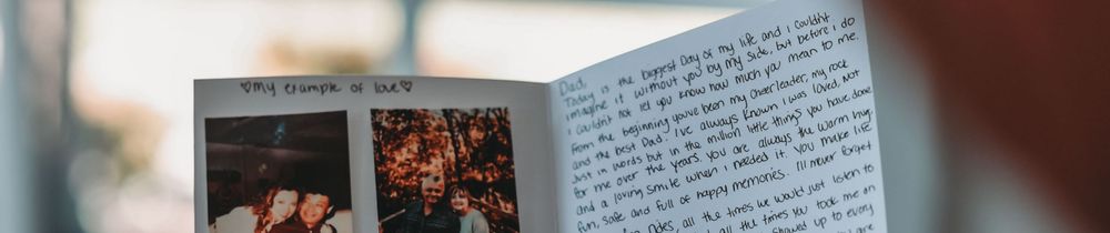 Open book or document pages showing handwritten text and printed materials.