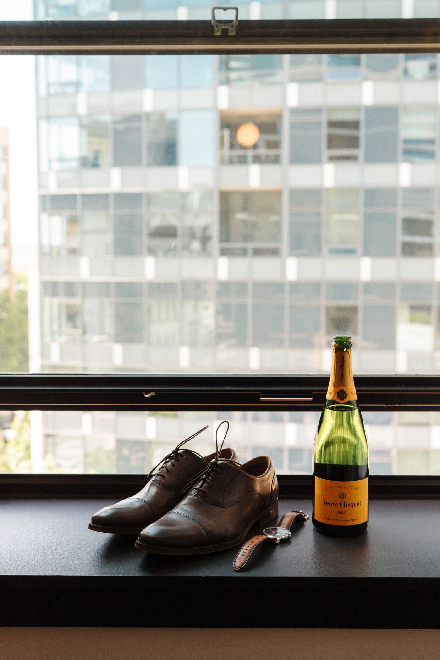 A trio of lifestyle photos showing dress shoes and champagne bottles silhouetted against a bright window.