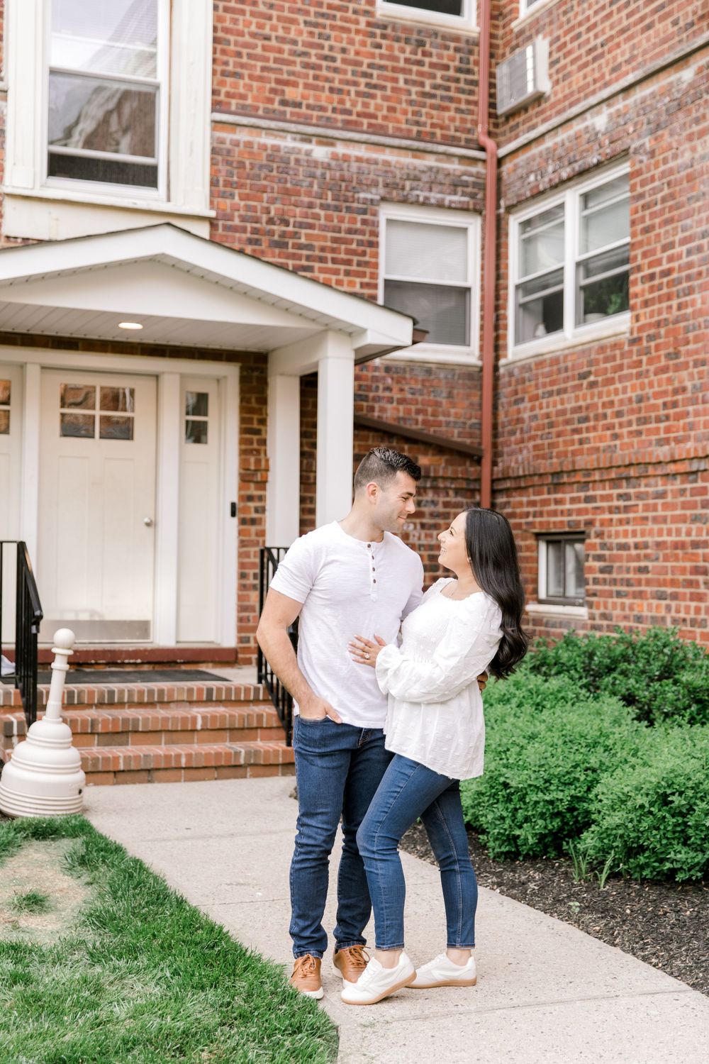 Engagement photo of couple at their first apartment Cranford, NJ at golden hour.