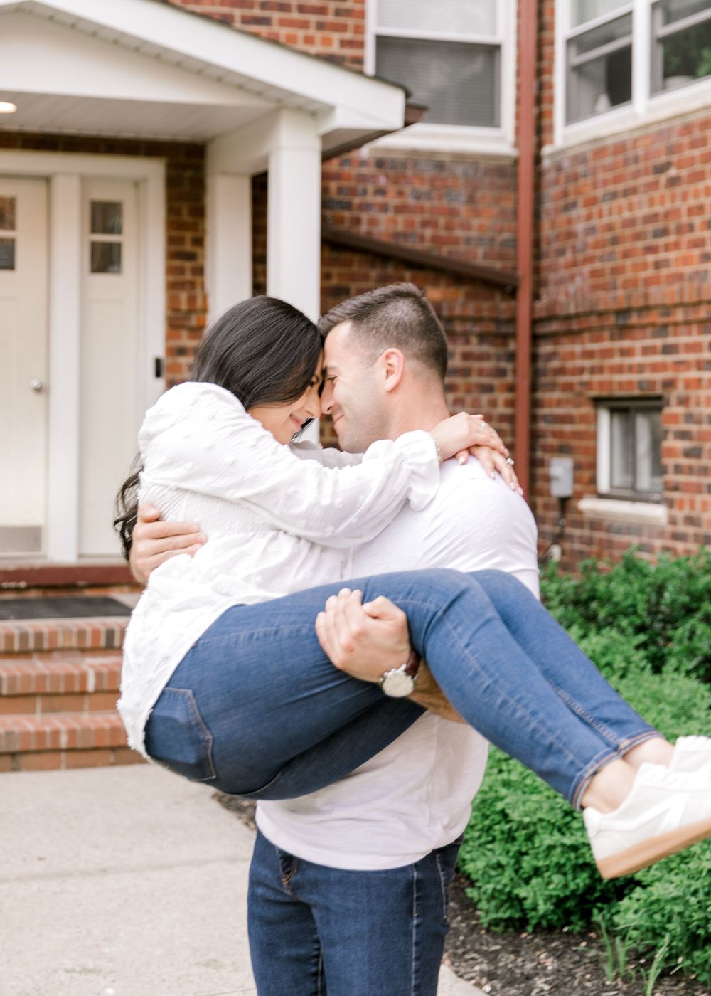 Engagement photo of couple at their first apartment Cranford, NJ at golden hour.