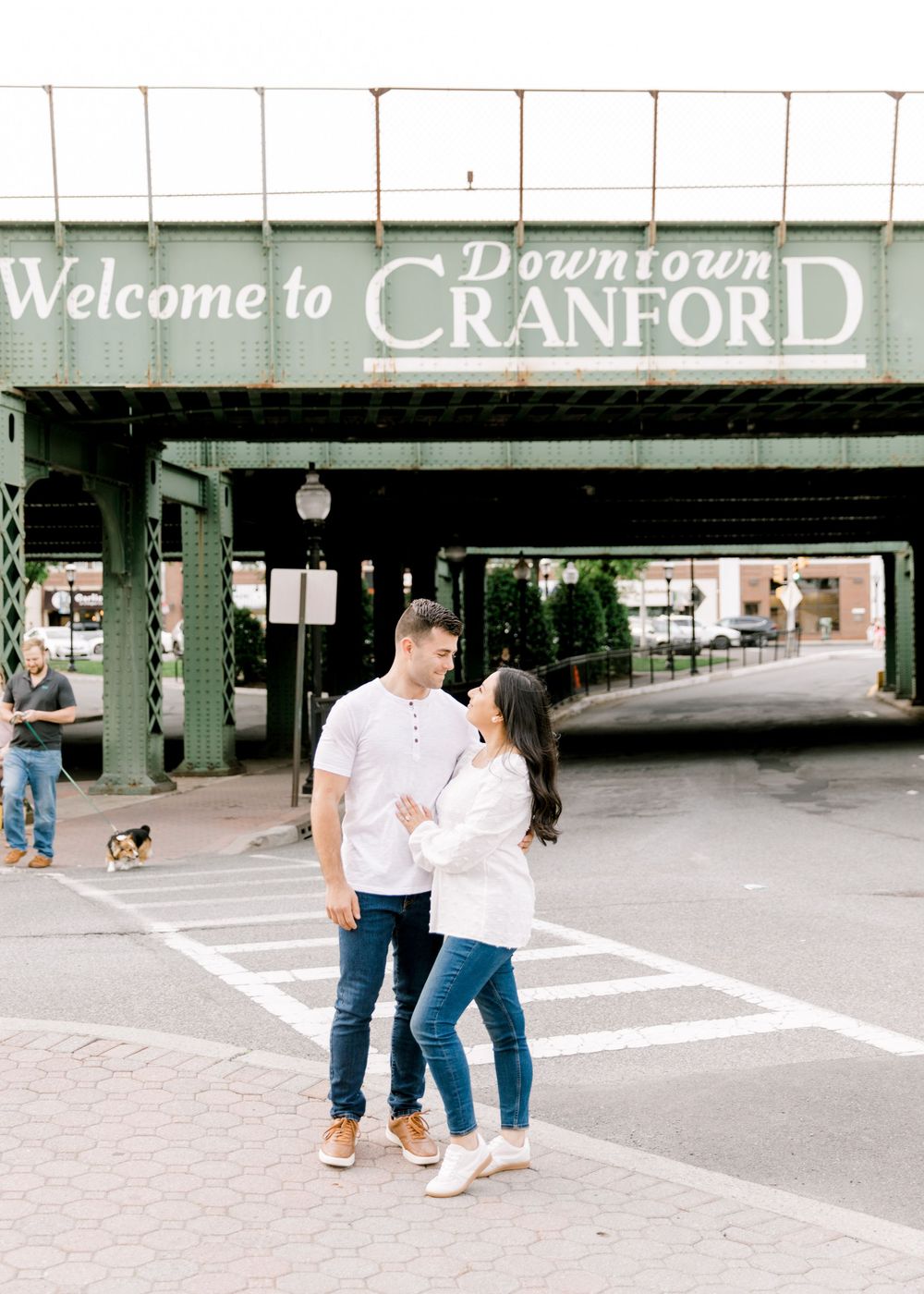 Engagement photo of couple smiling at each other in Cranford, NJ at golden hour.