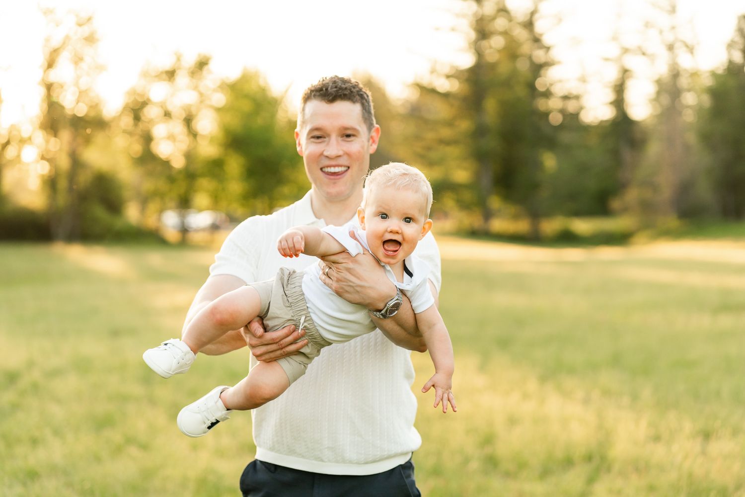 Dad playing with baby at sunset in North Bend.