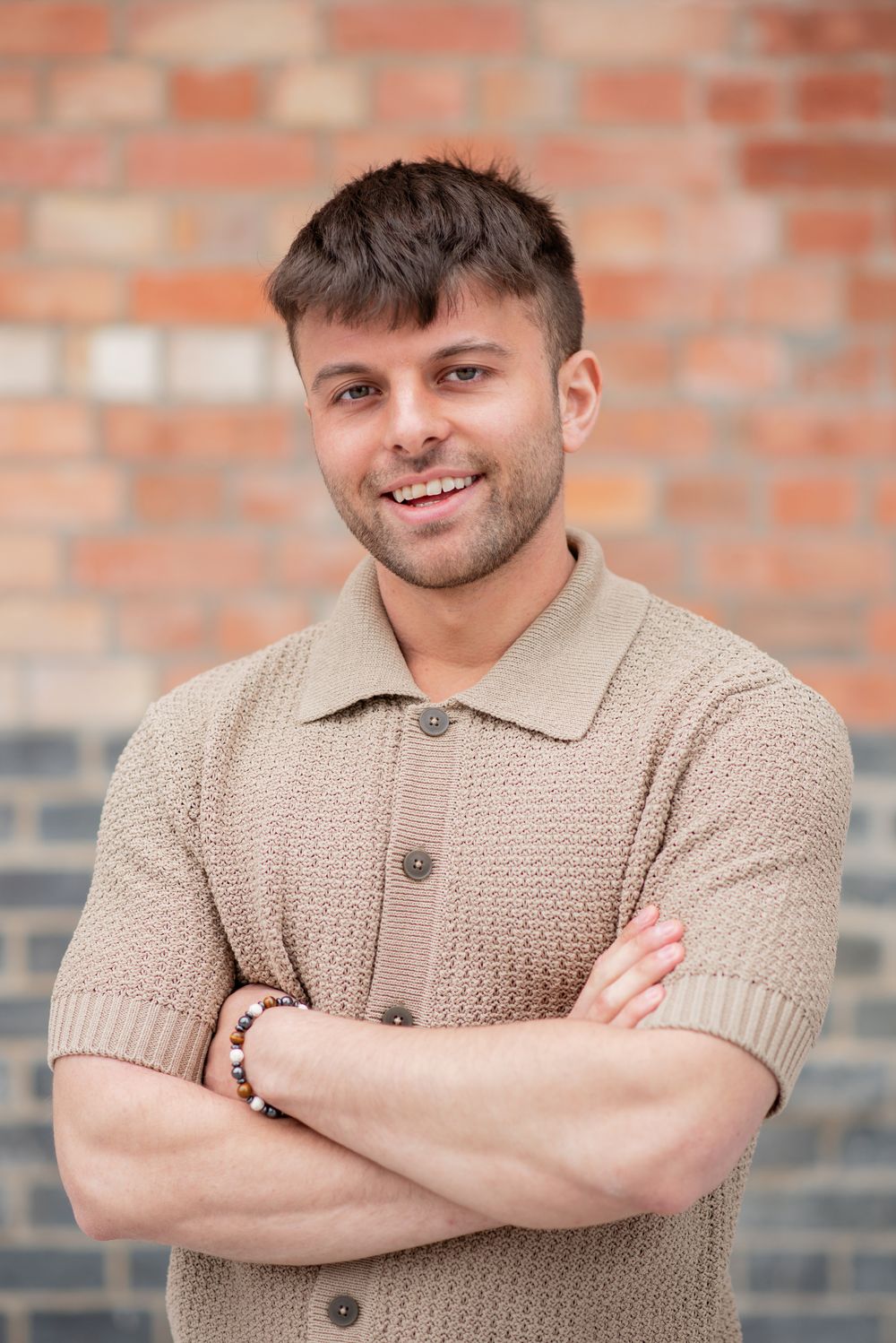 Candid corporate headshot outdoors – Outra team member