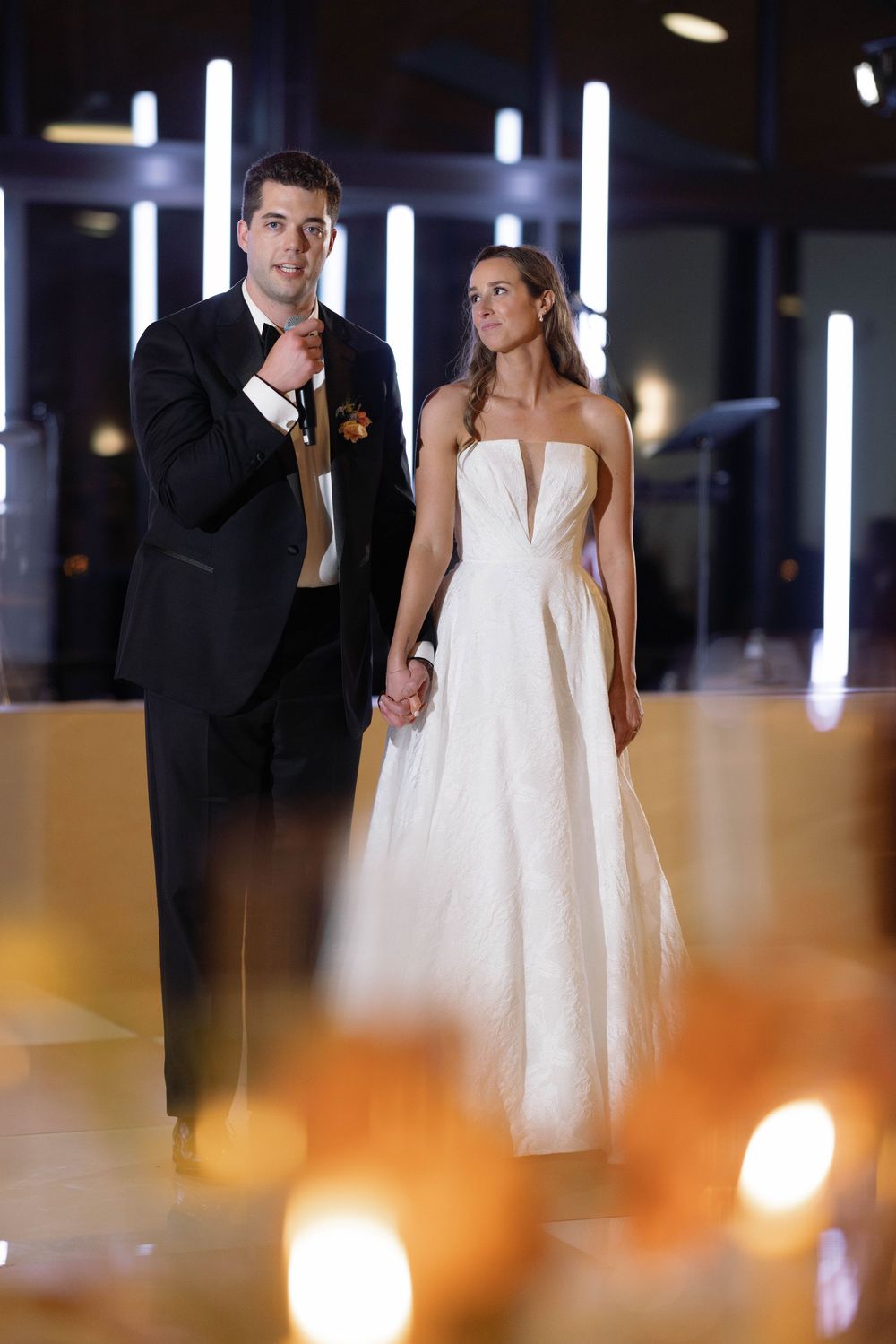A series of romantic wedding photos showing a newlywed couple dancing in an elegant reception venue with dramatic lighting.