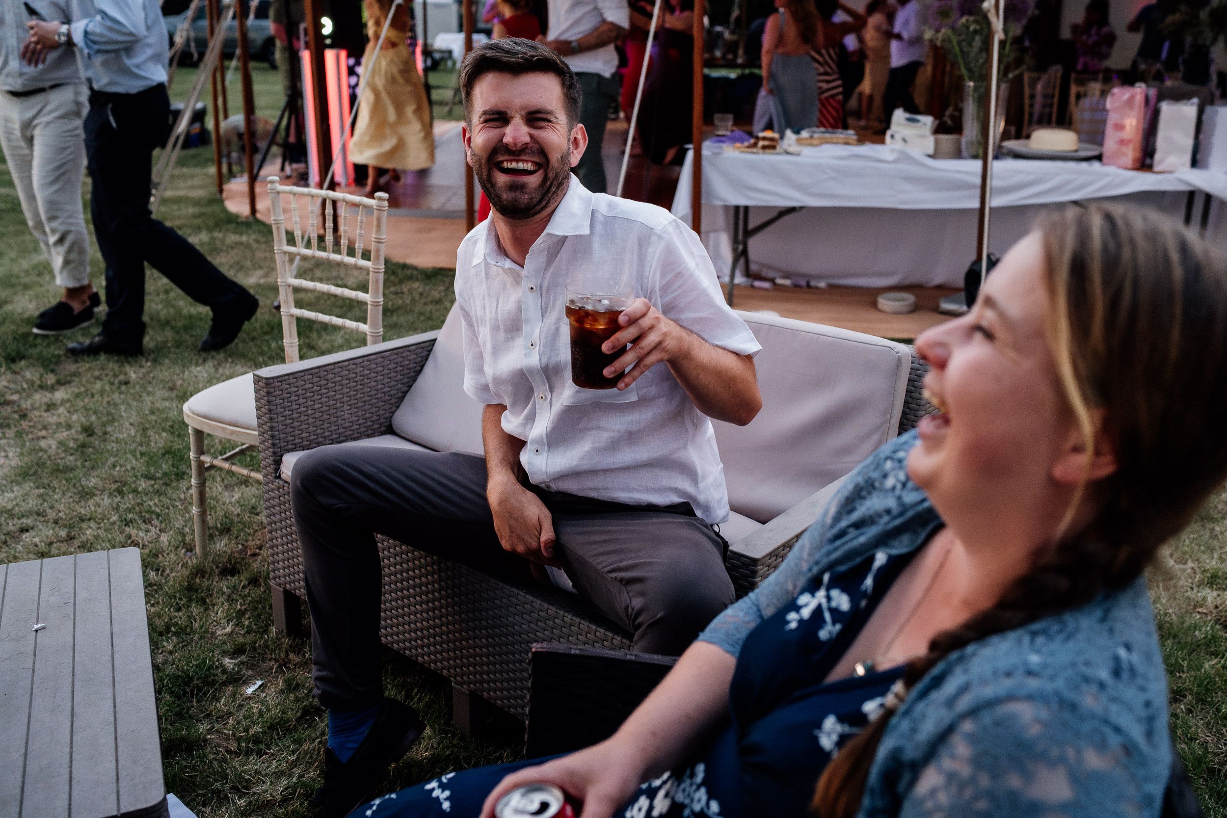 Five photos of people laughing and enjoying themselves at an outdoor social gathering.