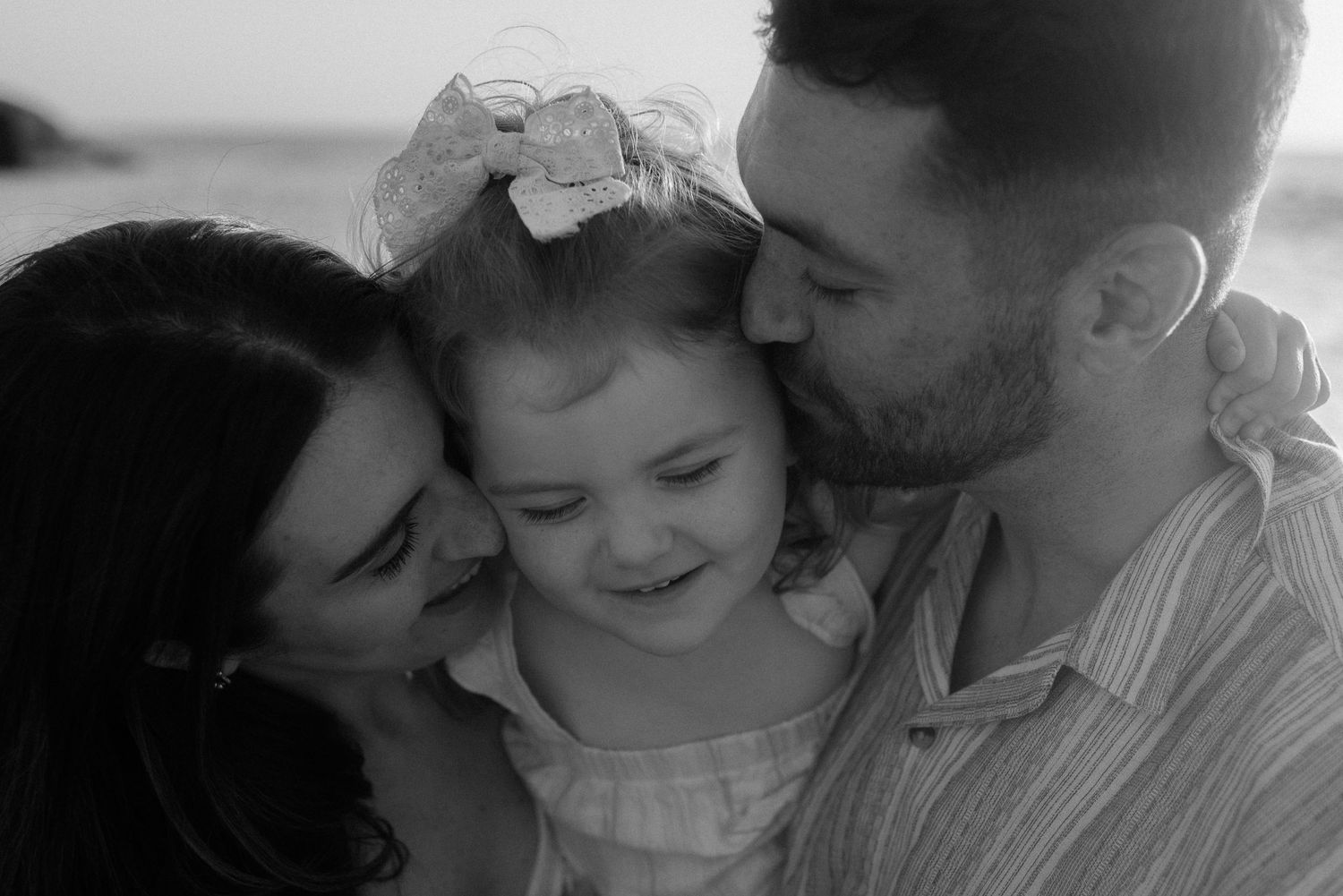 Intimate family moment captured in black and white photography. Tenerife Wedding Photographer at Playa del Duque, Adeje.
