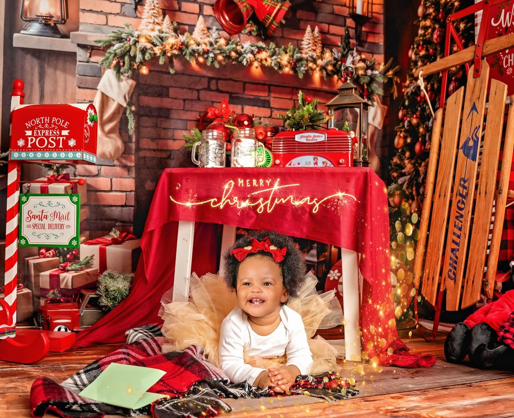 A rustic Christmas decor display with wooden sleds, red ornaments, lanterns, and string lights against a brick wall.