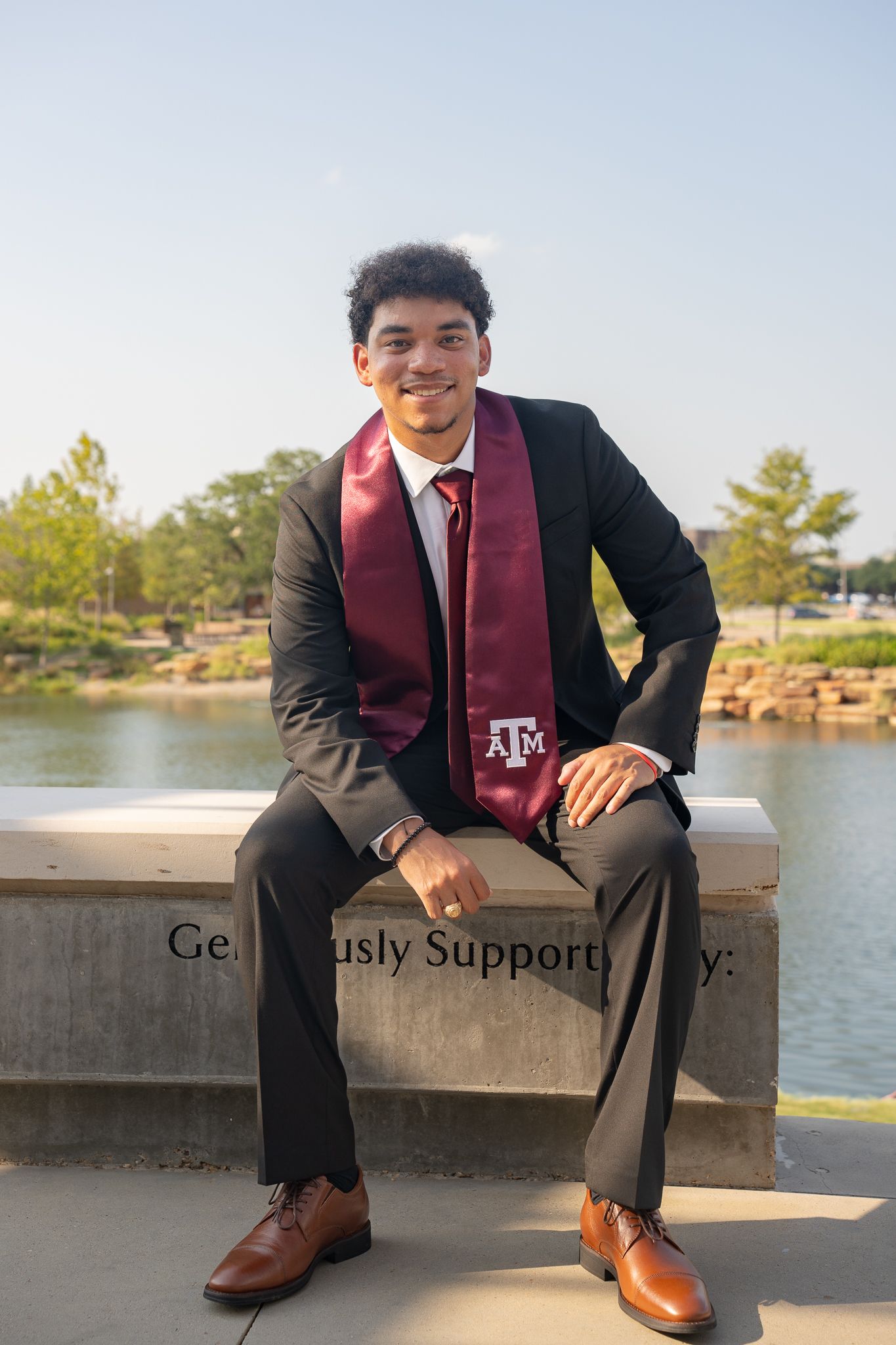 guy graduate posing in Texas A&M university college station