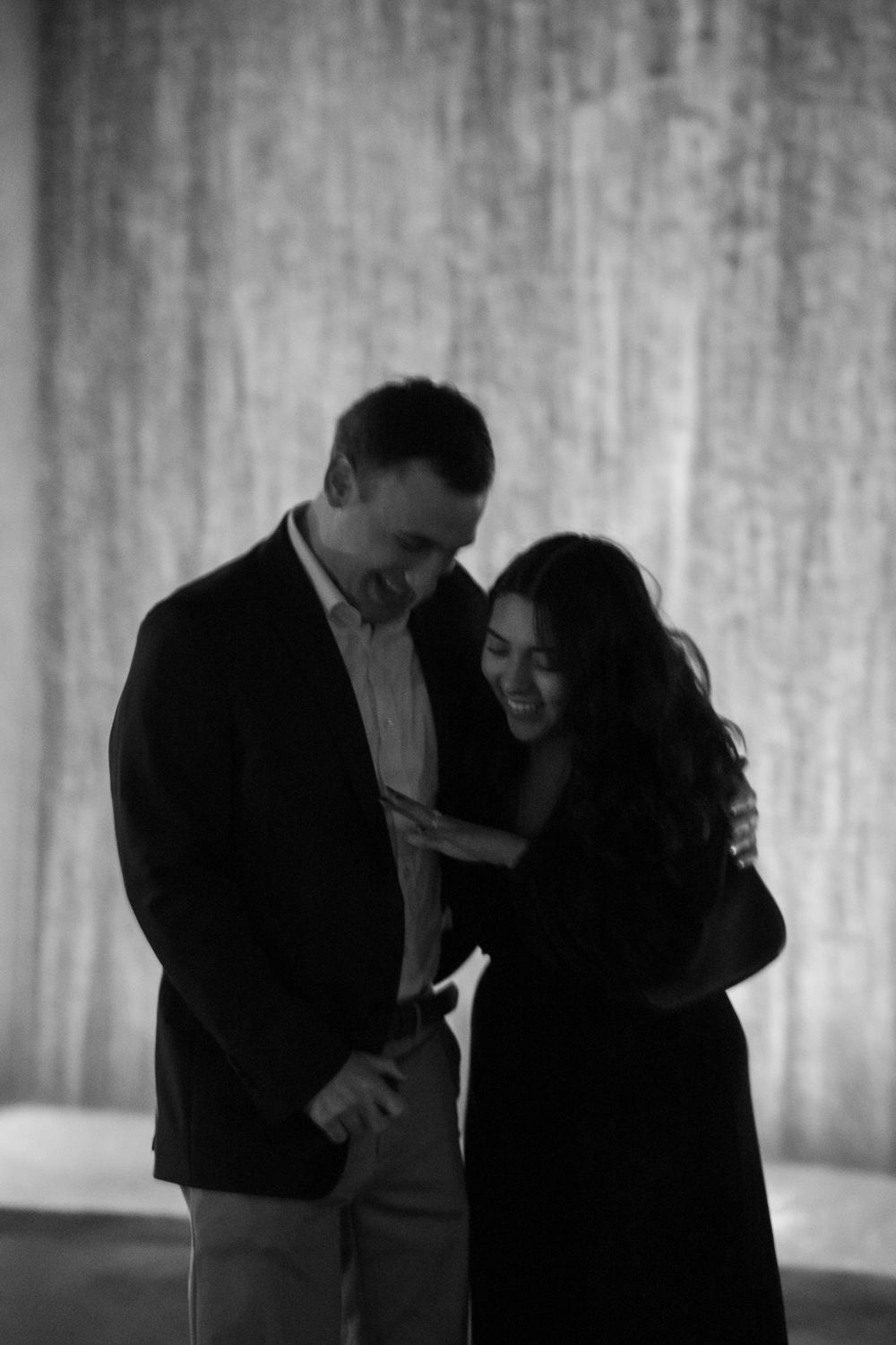 Intimate black and white portrait of a couple sharing a tender moment.