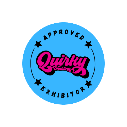 A circular blue badge with pink "Quirky" text and stars reading "Approved Exhibitor" in black lettering.