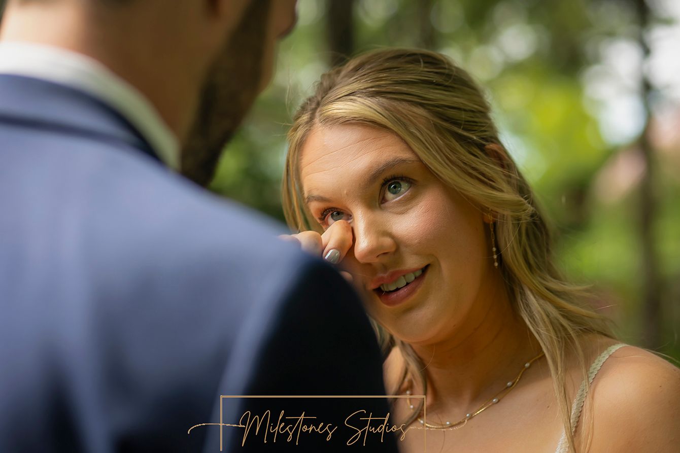 bride wiping tear