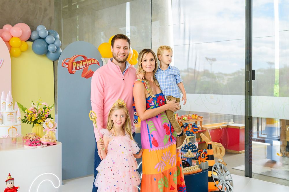 Colorful birthday party celebration with balloons and decorations in a bright modern space.