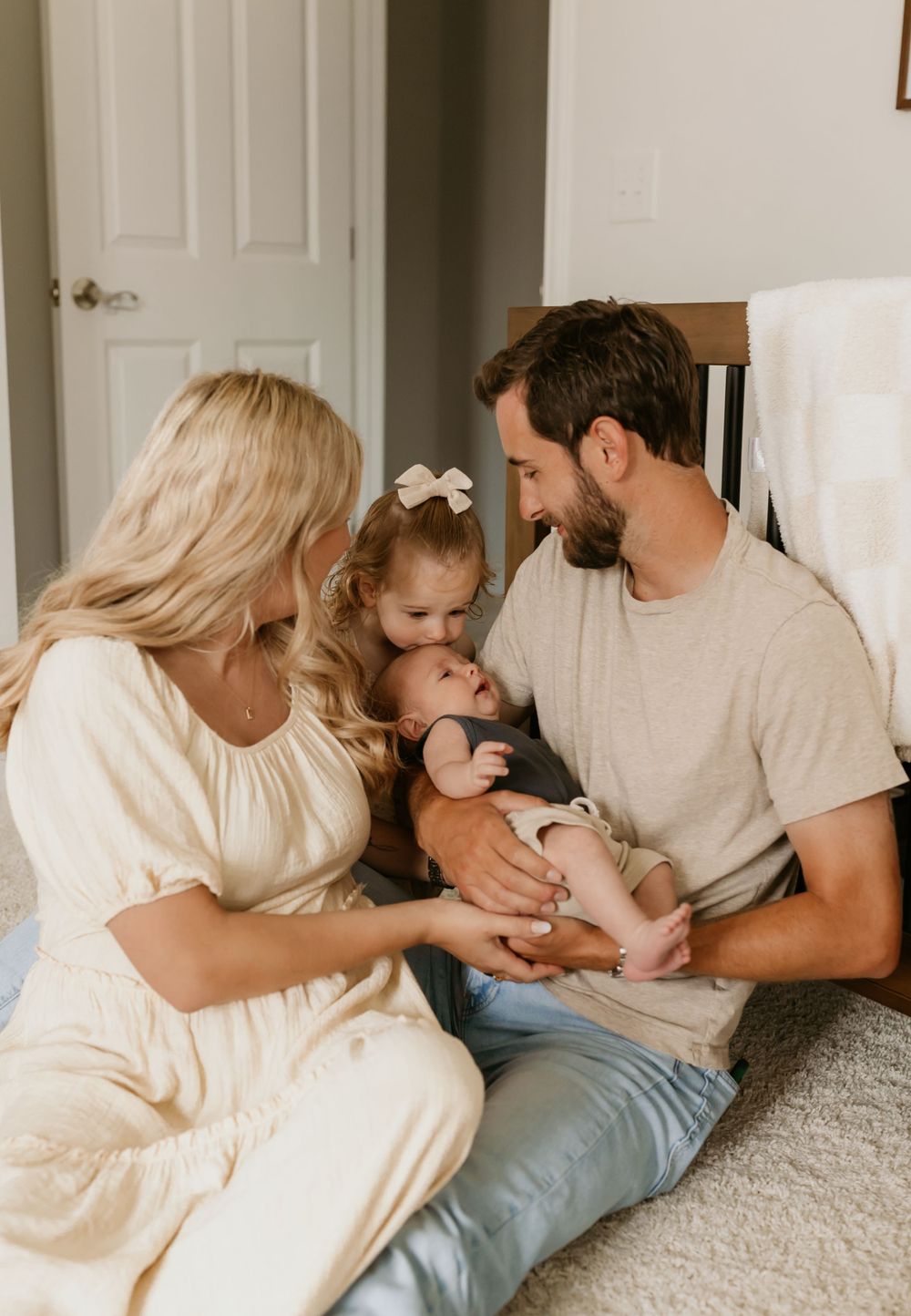 A heartwarming family scene on a cozy bed.