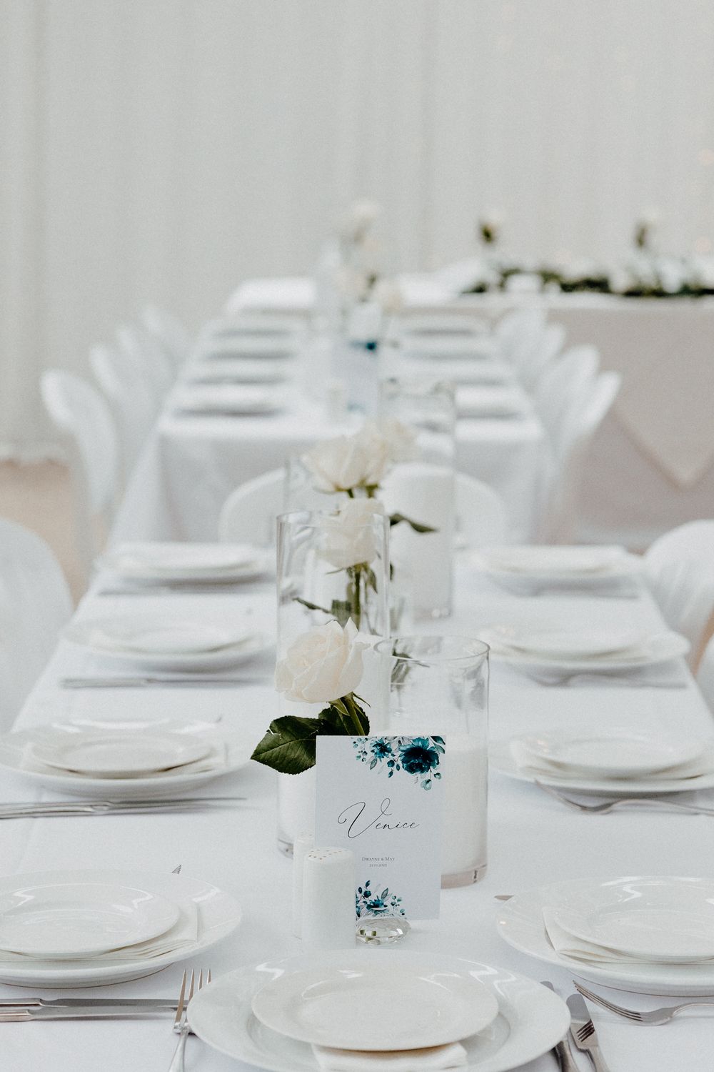 Elegant white table setting with minimalist place cards captured by Apertured Media Auckland Wedding Photographer