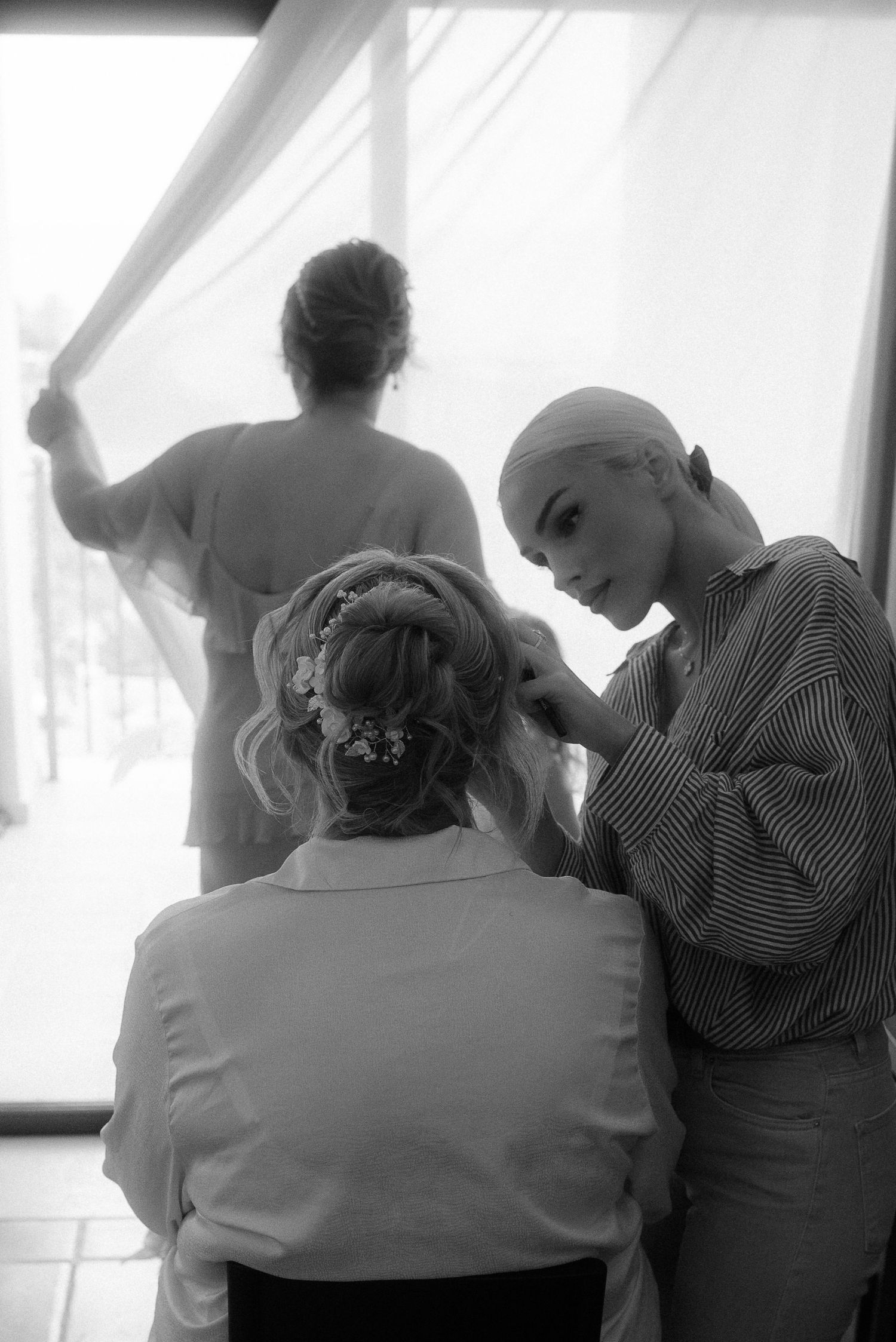 Behind-the-scenes preparation with makeup artists getting ready for a special event.