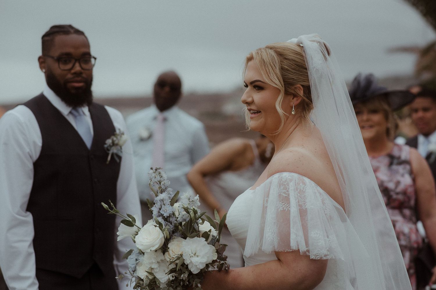 An emotional outdoor wedding ceremony moment captured against a coastal backdrop. Tenerife Wedding Photographer at Hotel Vincci