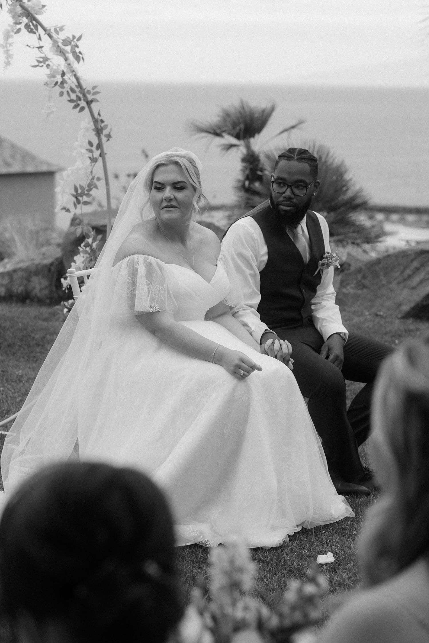 Black and white wedding portrait with palm trees and ocean backdrop. Tenerife Wedding Photographer at Hotel Vincci La Plantación del Sur