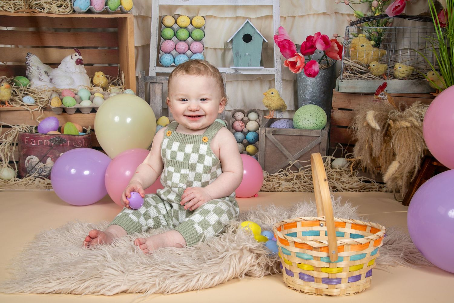 Easter scene with pastel balloons, colored eggs, decorative baskets and fluffy rug in soft spring colors.
