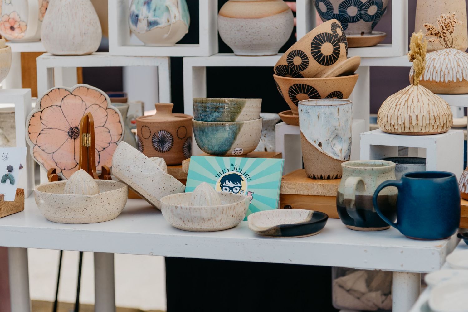 Julie Mackinnon Ceramics and Hey Julie School of Clay vendor table at the Saturday Market on Salt Spring Island