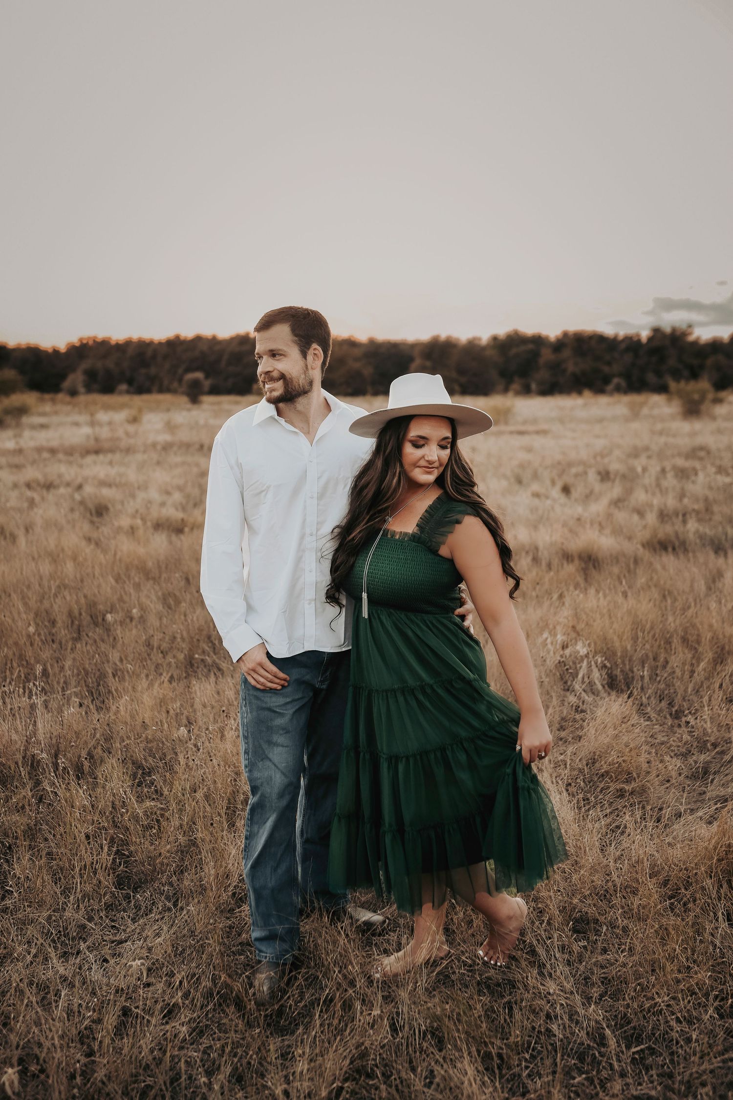 a gorgeous couple poses for their engagement photos with april pinto photography
