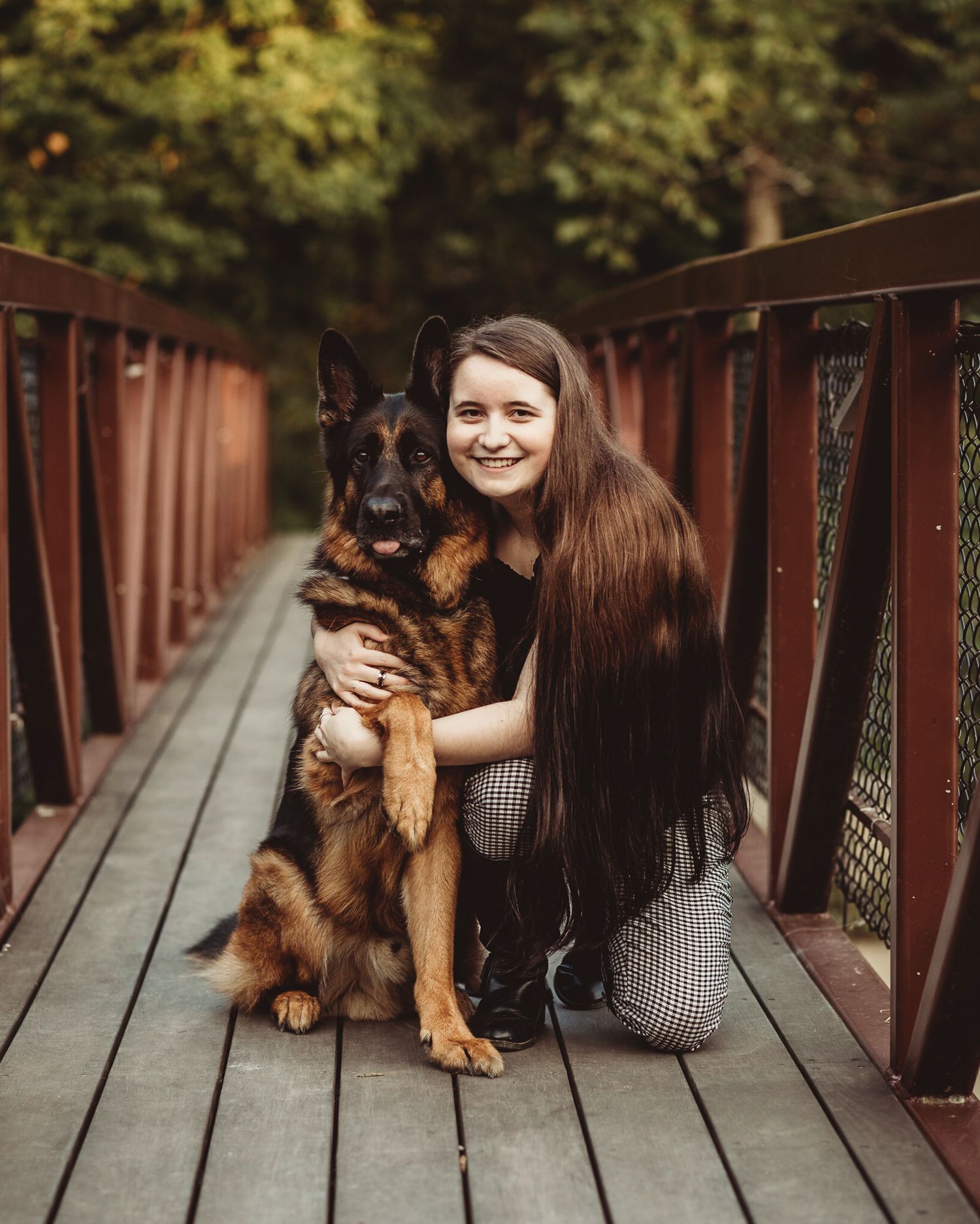 Professional senior photo of a girl with her dog