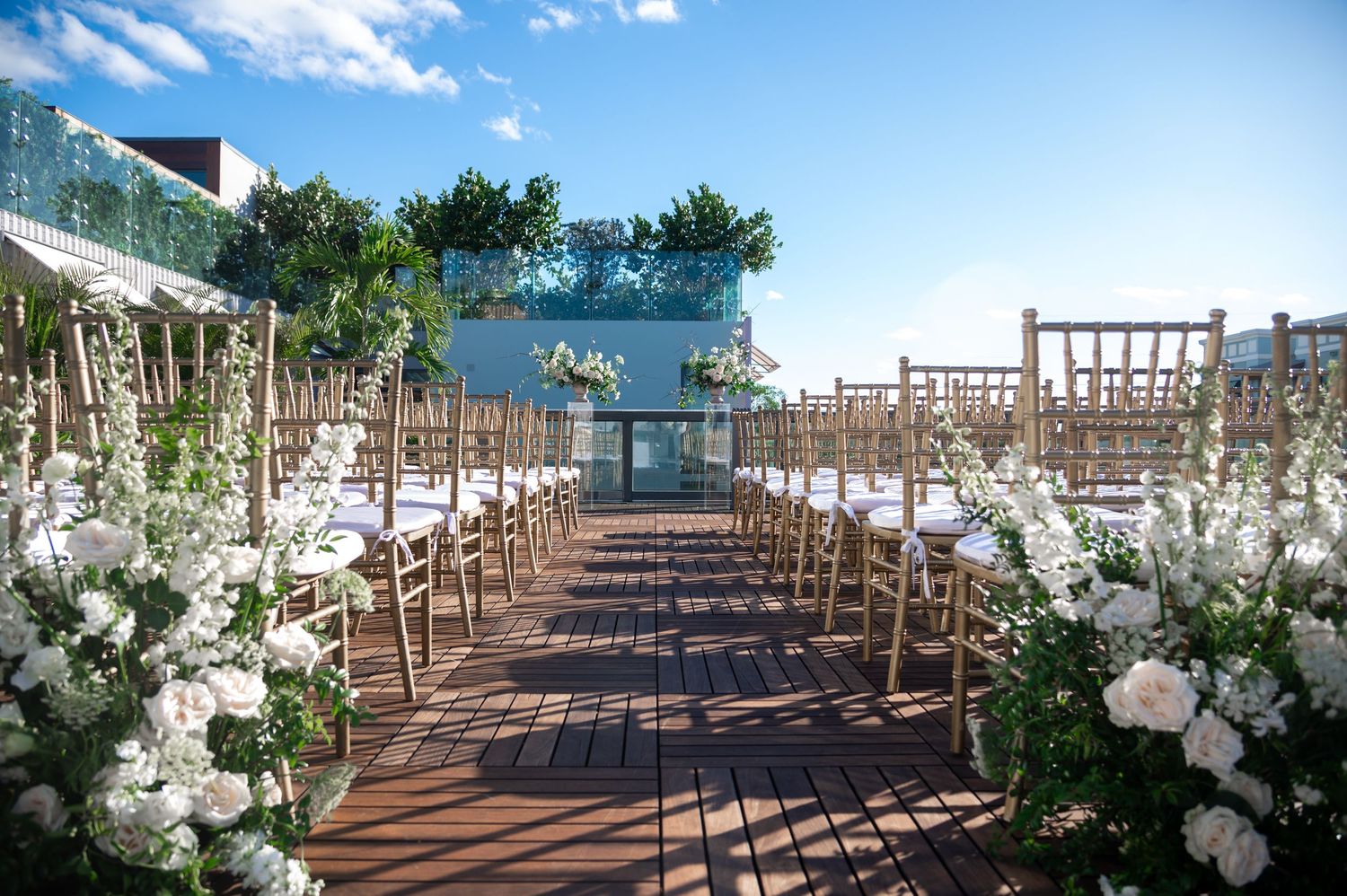 Black and white rooftop portrait by luxury wedding photographers in Florida during golden hour
