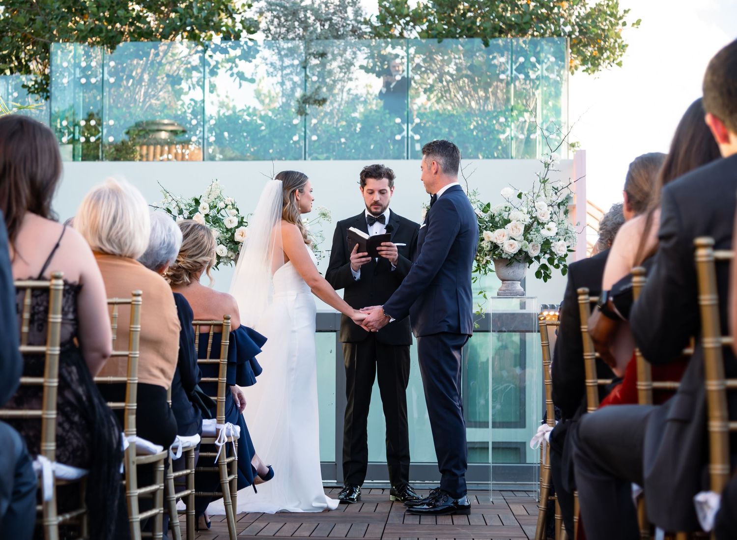 Rooftop vows exchanged at golden hour by Emma & Jeff, photographed by Treasure Coast wedding photographers